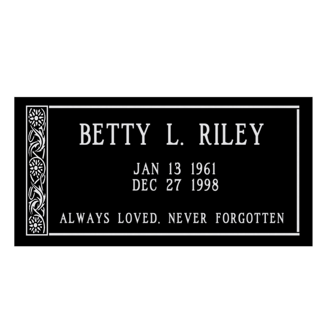 Flat, black granite marker with detailed flowers engraved on the left side.