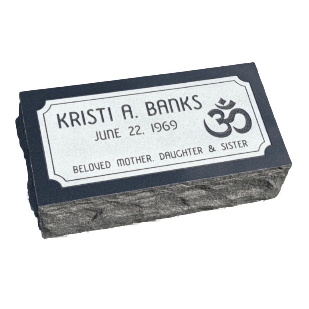 Black granite pillow marker with white border.