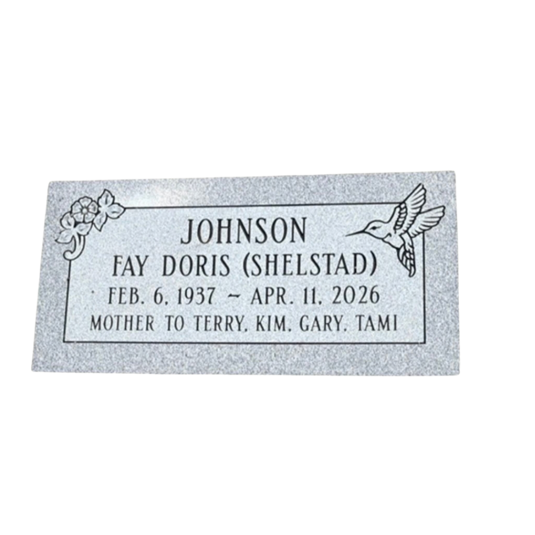Flat light grey granite marker with flowers and a hummingbird.
