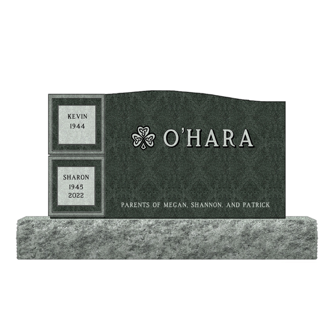 Cremation memorial/personal columbarium in green granite and featuring a shamrock.