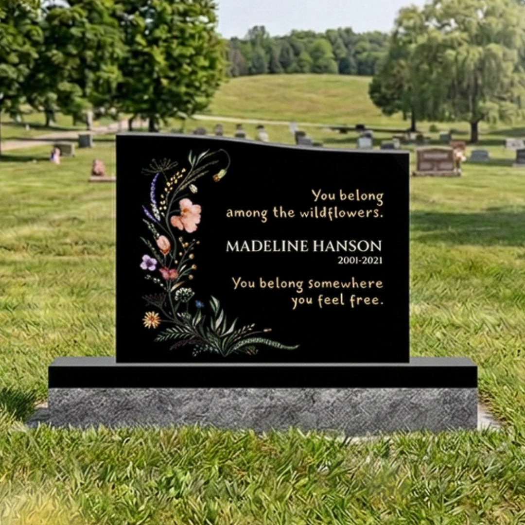 Upright black granite monument featuring color laser engraving.