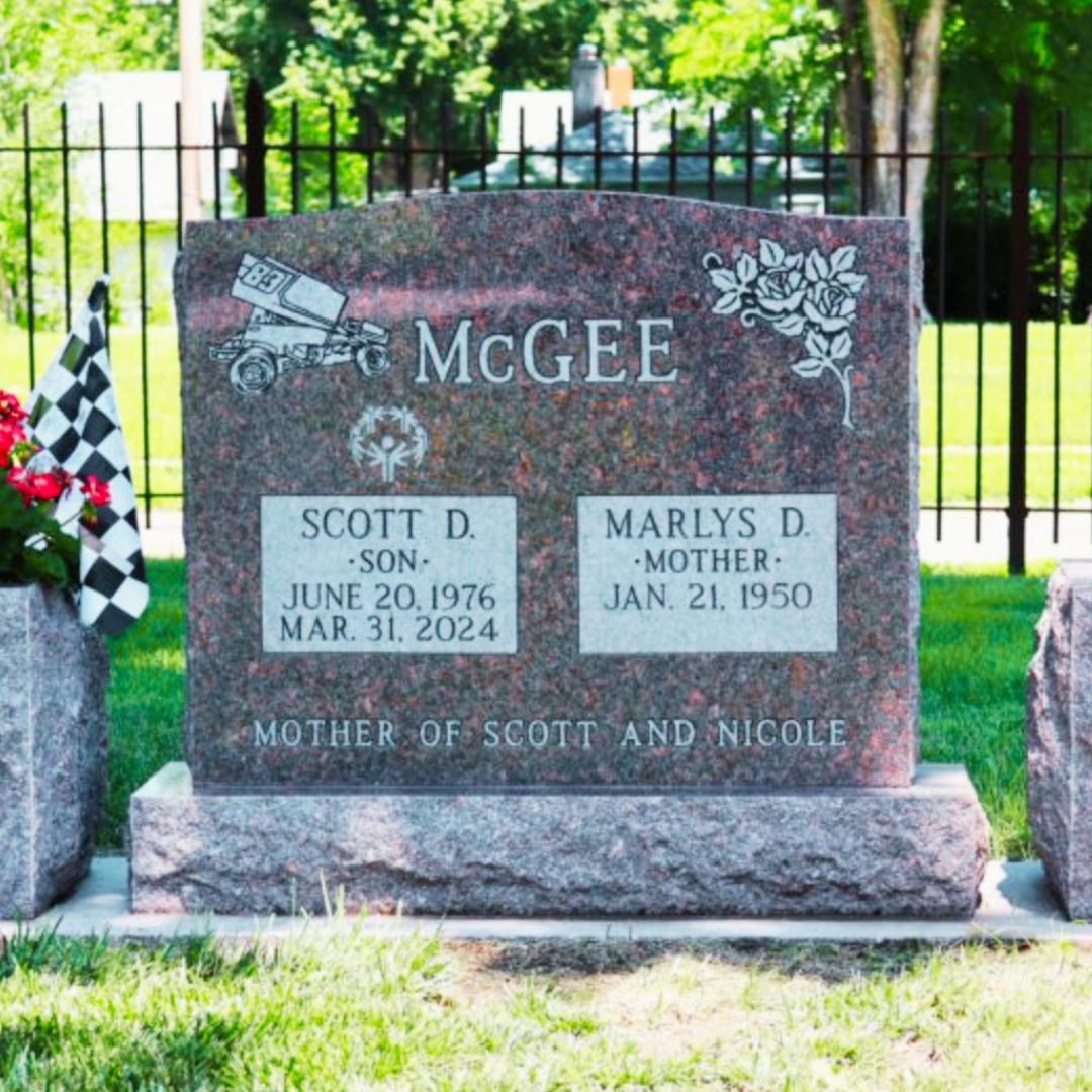 Upright companion monument featuring the names of the mother and son, and images of flowers and a dump truck.