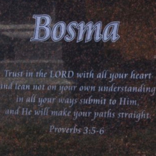 Upright monument featuring verses from the Bible.