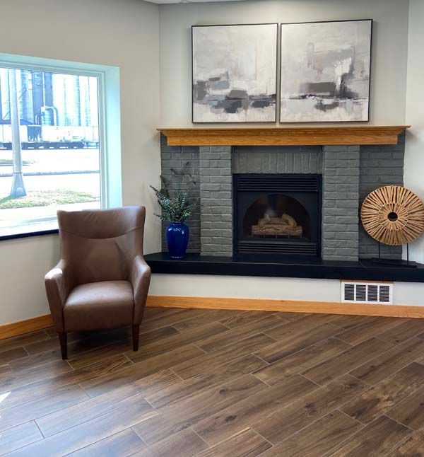 A cozy fireplace in side the office area.
