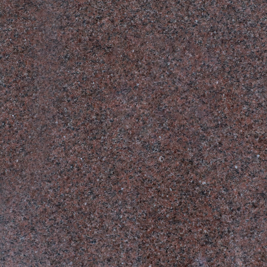 Rose-colored granite with black and grey specks.