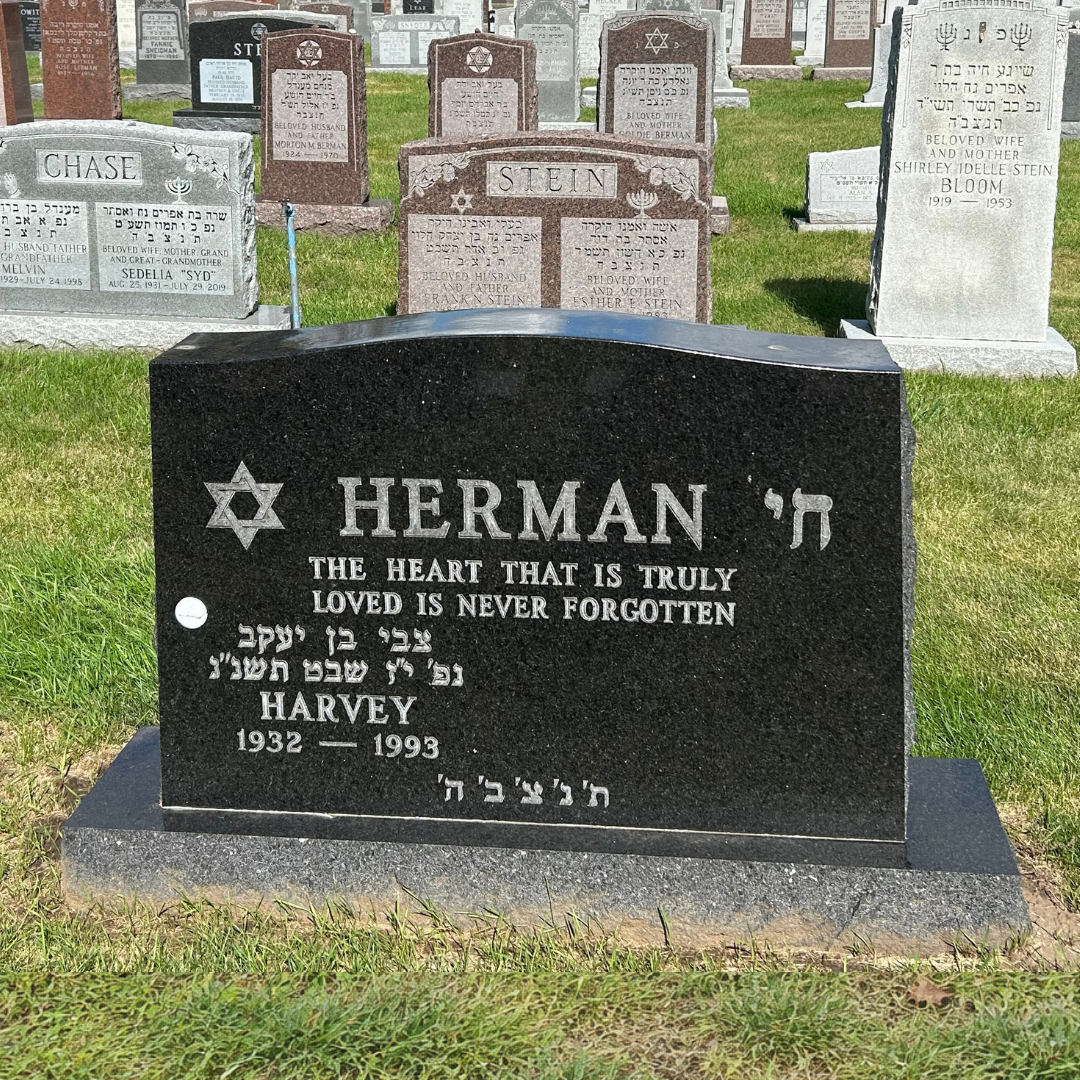 Upright companion monument in a Jewish cemetery.