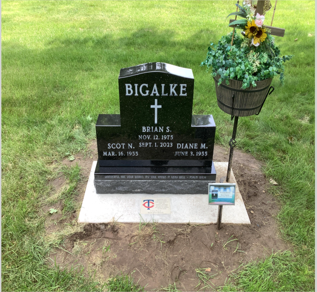 Black granite upright companion monument.