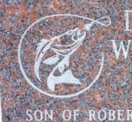 Fish engraved on a headstone.