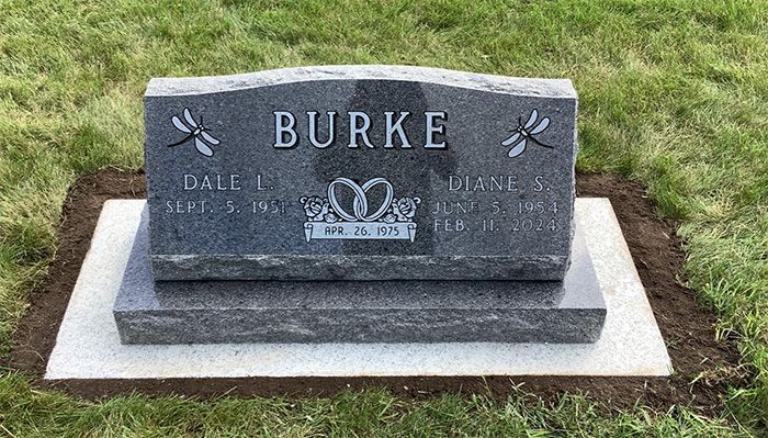 A slant marker with the name Burke on the back.The front surface slants at a 45 degree angle, making the memorial easy to read because the engraving is angled towards a visitor’s line of sight.