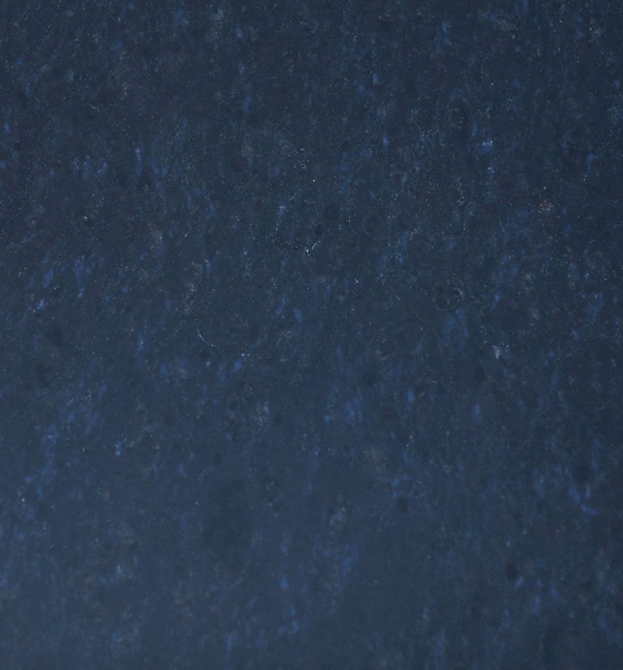 Dark blue granite with light blue and white specks.