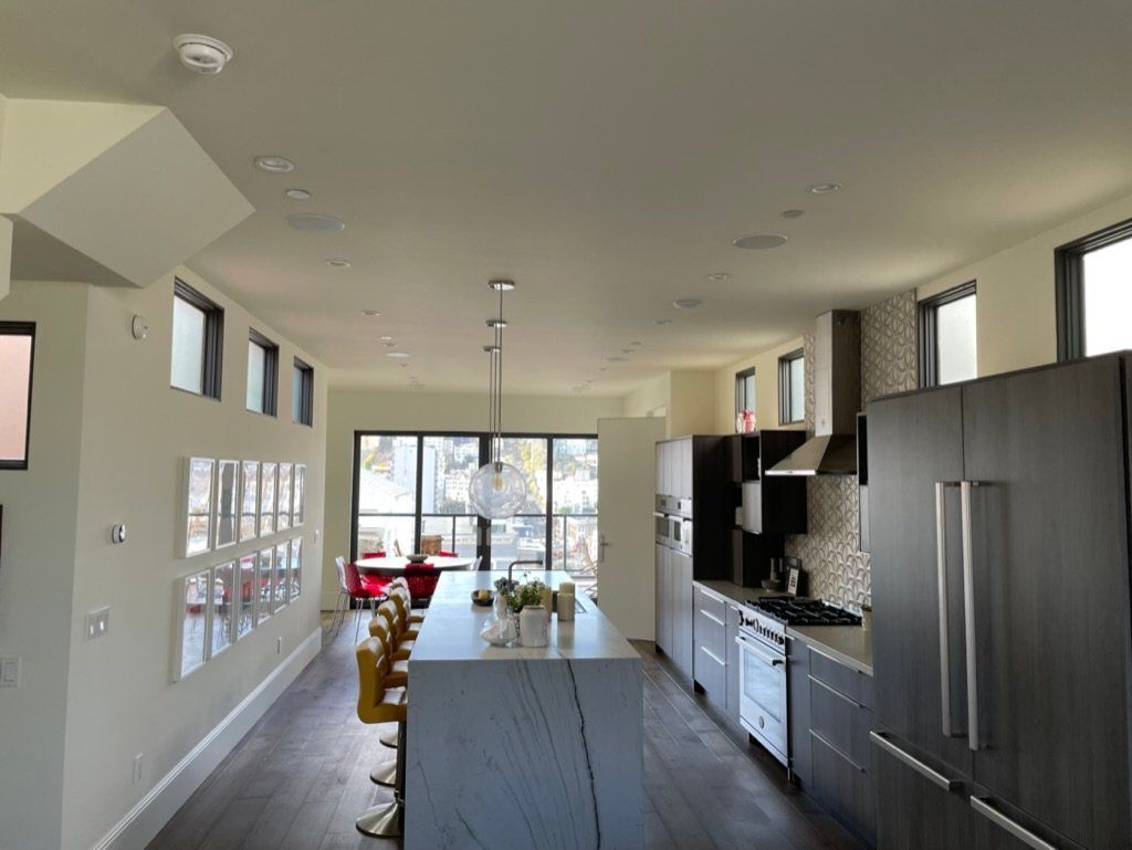 A large kitchen with a large island in the middle