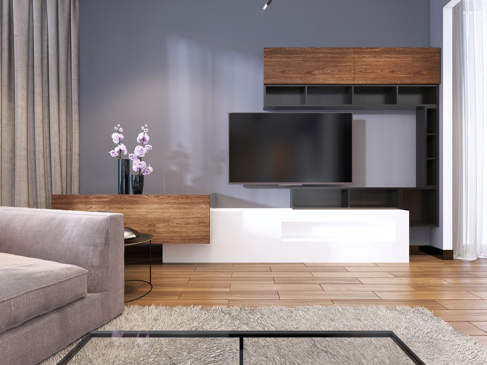 A living room with a couch , television , and coffee table.