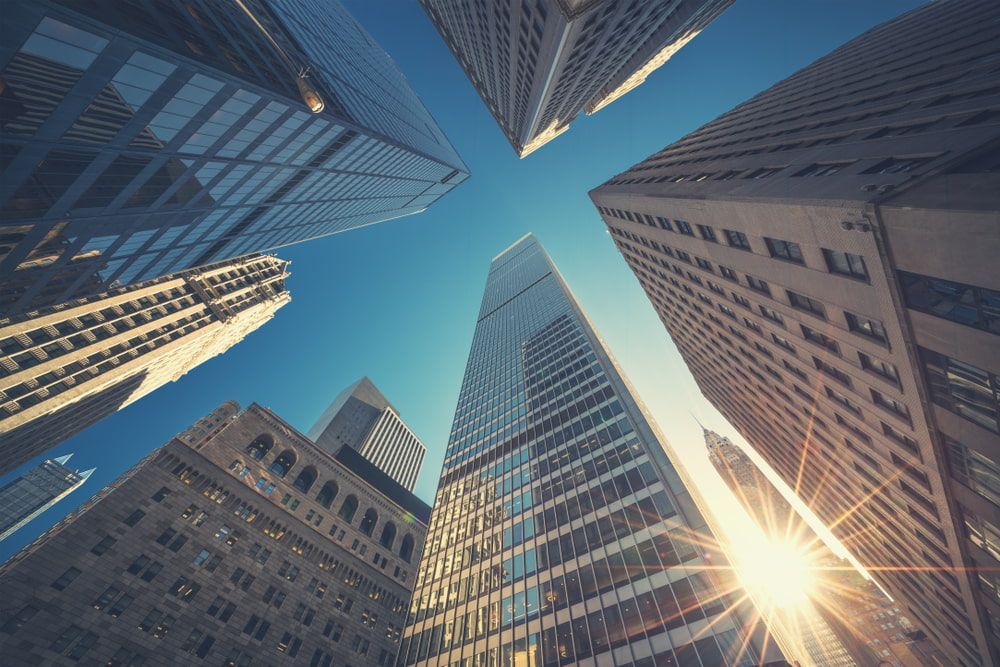 The Sun is Shining Through the Windows of a City Skyscraper — Pollock Ingram Solicitors in Caloundra, QLD