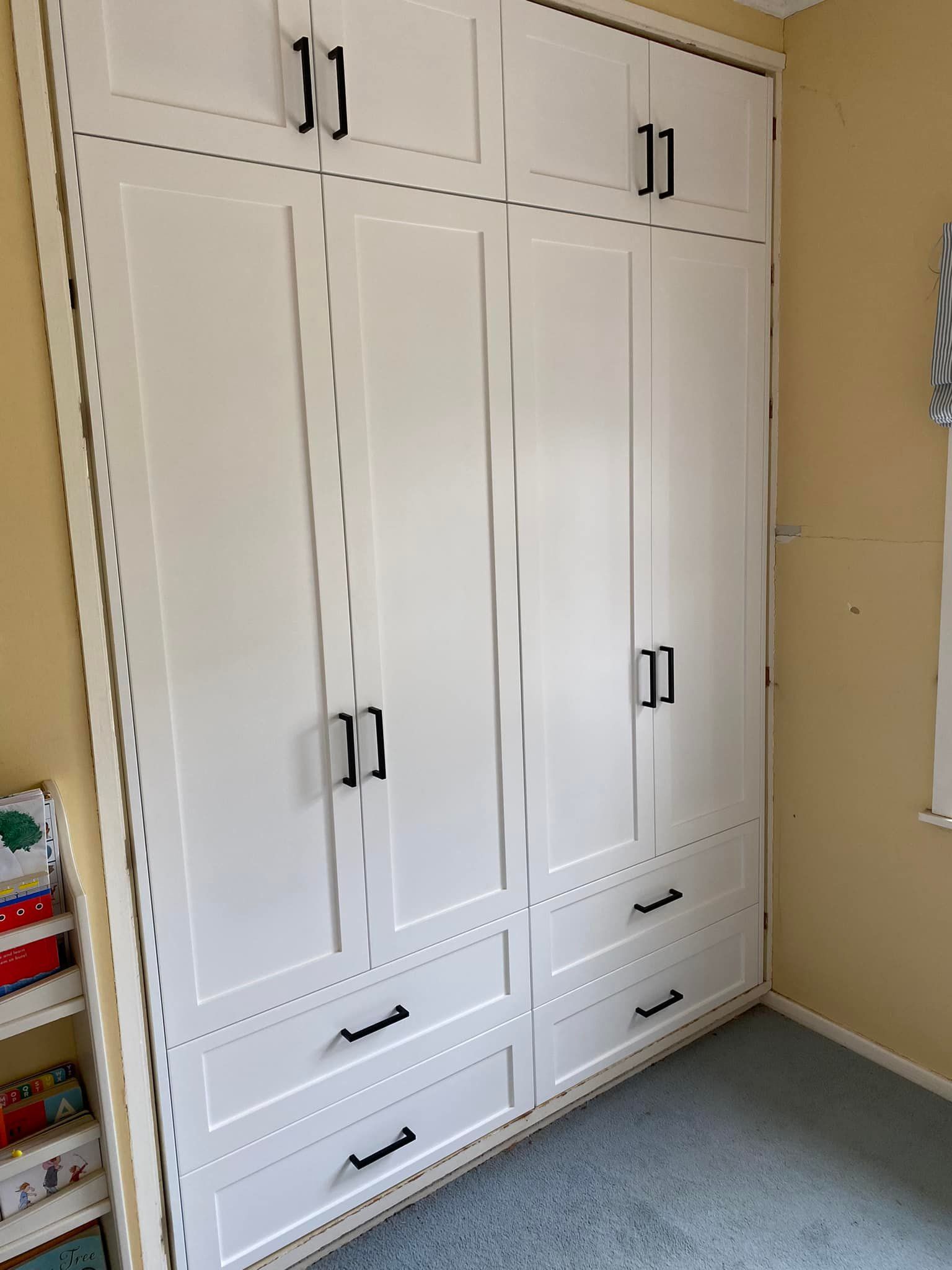 A Large White Wardrobe With Drawers and Cabinets in a Room — Moore Than Just Kitchens In Tamworth, NSW