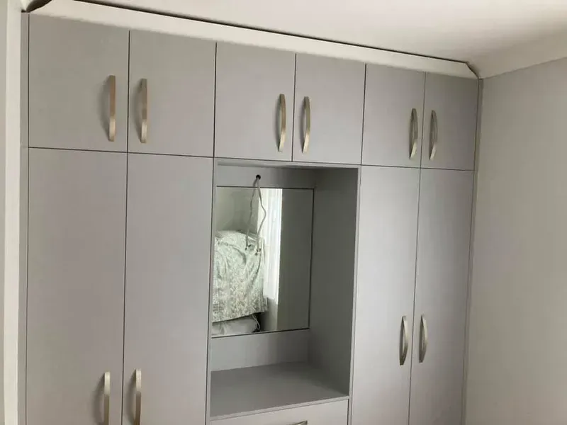 A Bedroom With a Lot of Cabinets and a Mirror — Moore Than Just Kitchens In Narrabri, NSW