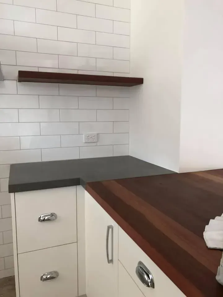 A Kitchen With White Cabinets and a Wooden Counter Top — Moore Than Just Kitchens In Manilla, NSW