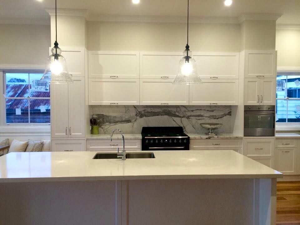 A Kitchen With White Cabinets and a Large Island in the Middle — Moore Than Just Kitchens In Manilla, NSW