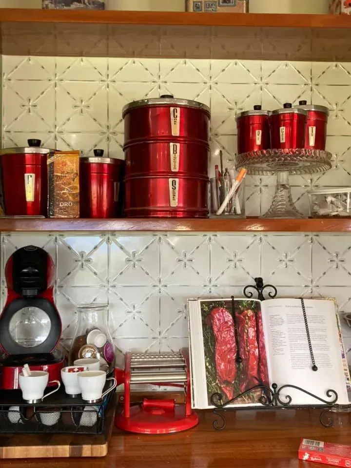 There Are Many Red Pots and Pans on the Shelves in the Kitchen — Moore Than Just Kitchens In Manilla, NSW