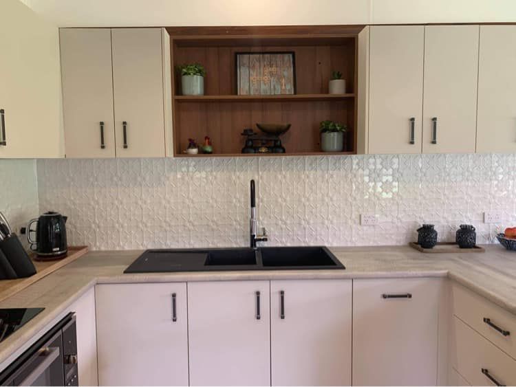 A Kitchen With White Cabinets and a Black Sink — Moore Than Just Kitchens In Gunnedah, NSW
