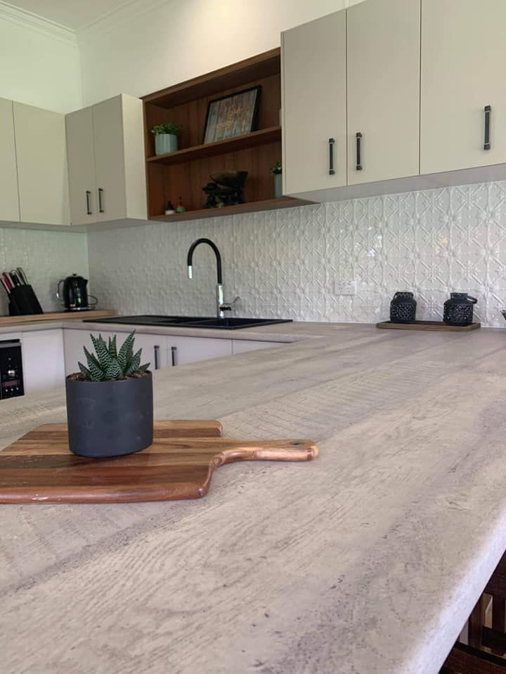 A Kitchen Counter With a Potted Plant and a Cutting Board — Moore Than Just Kitchens In Wee Waa, NSW