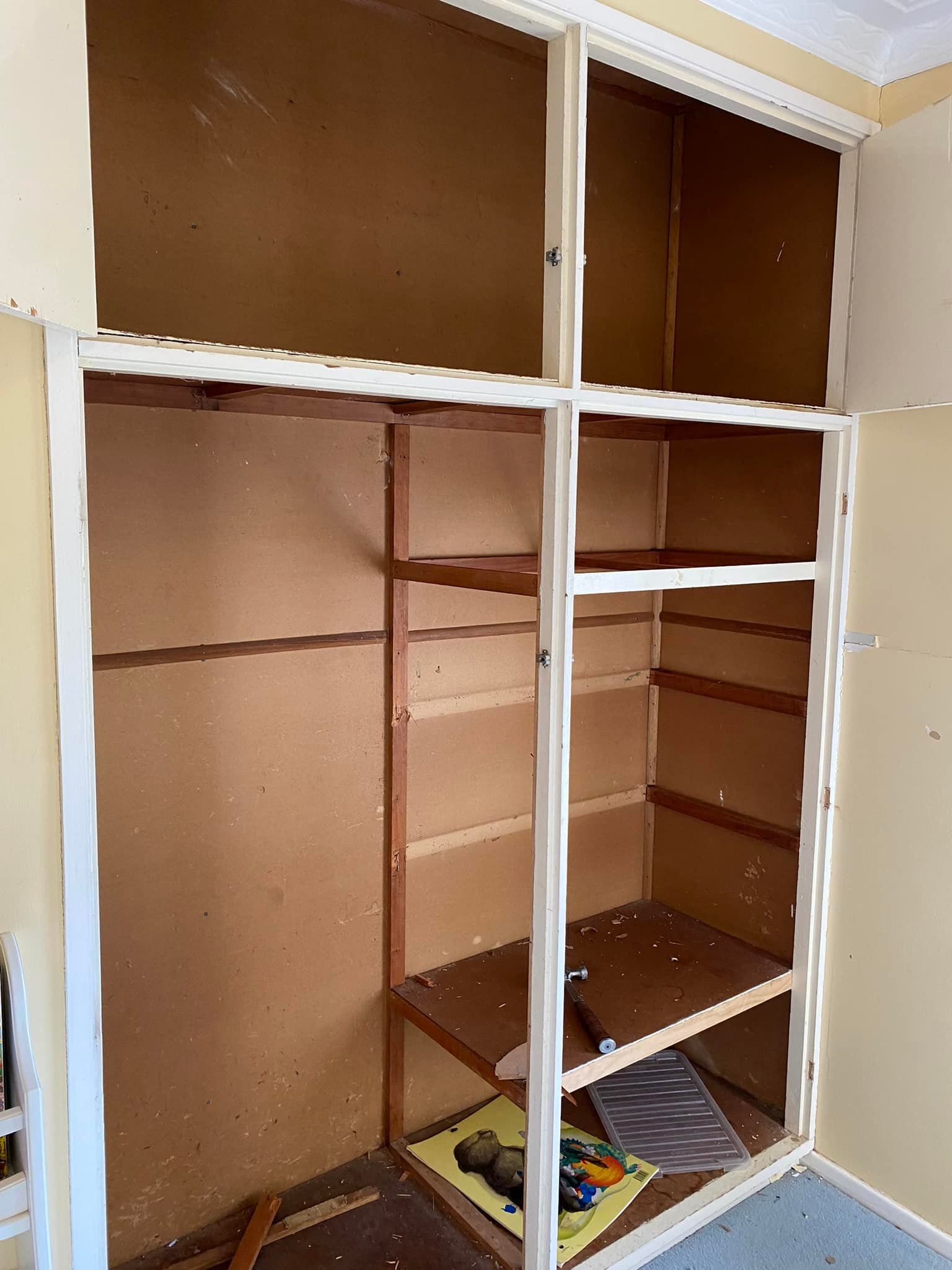 An Empty Closet With Wooden Shelves in a Room — Moore Than Just Kitchens In Tamworth, NSW