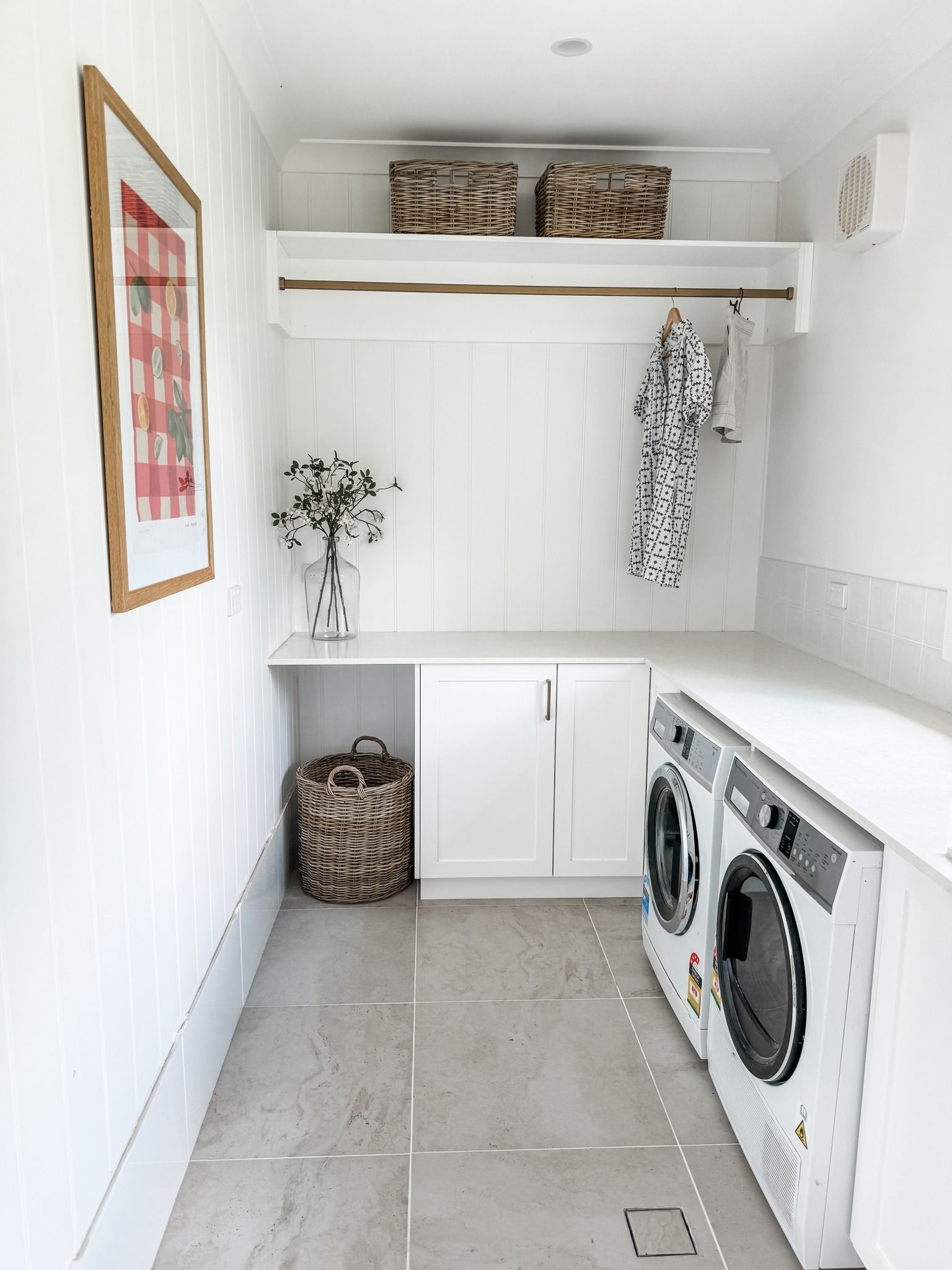 A Laundry Room With a Washer and Dryer and a Basket on the Floor — Moore Than Just Kitchens In Manilla, NSW