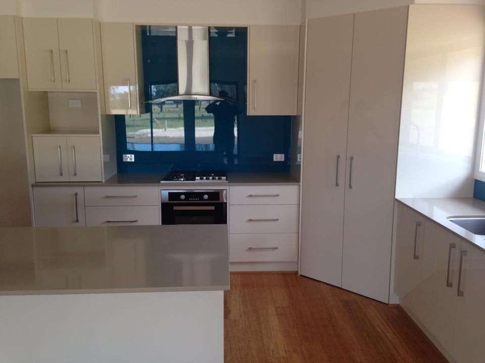 A Kitchen With White Cabinets and Stainless Steel Appliances — Moore Than Just Kitchens In Wee Waa, NSW