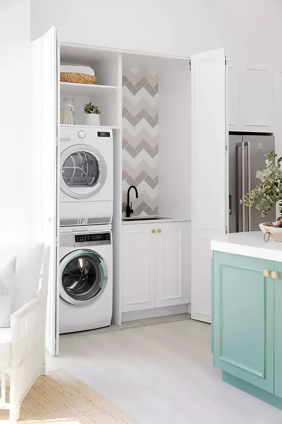A Laundry Room With a Washer and Dryer Stacked — Moore Than Just Kitchens In Manilla, NSW