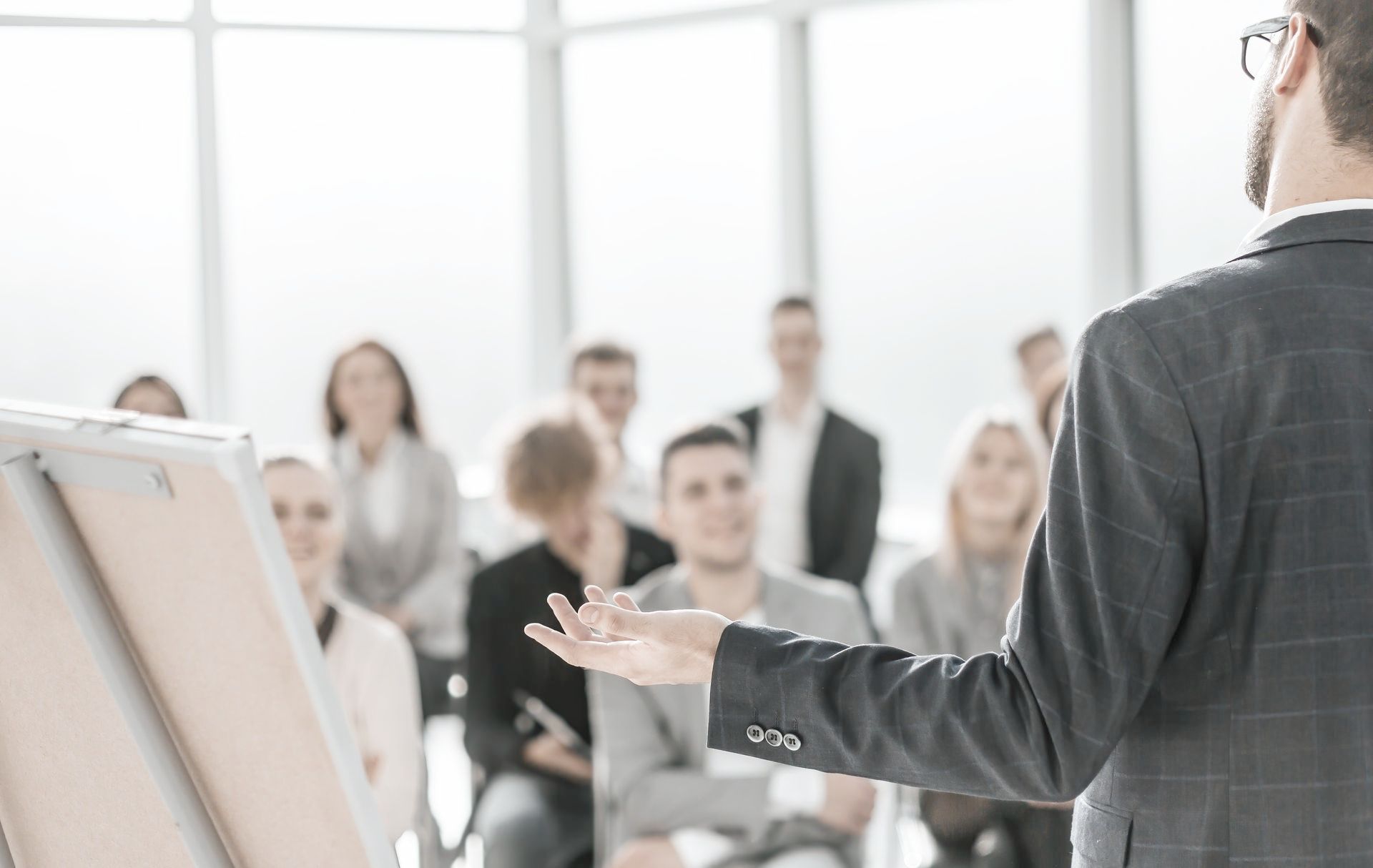 A man is giving a presentation to a group of people.