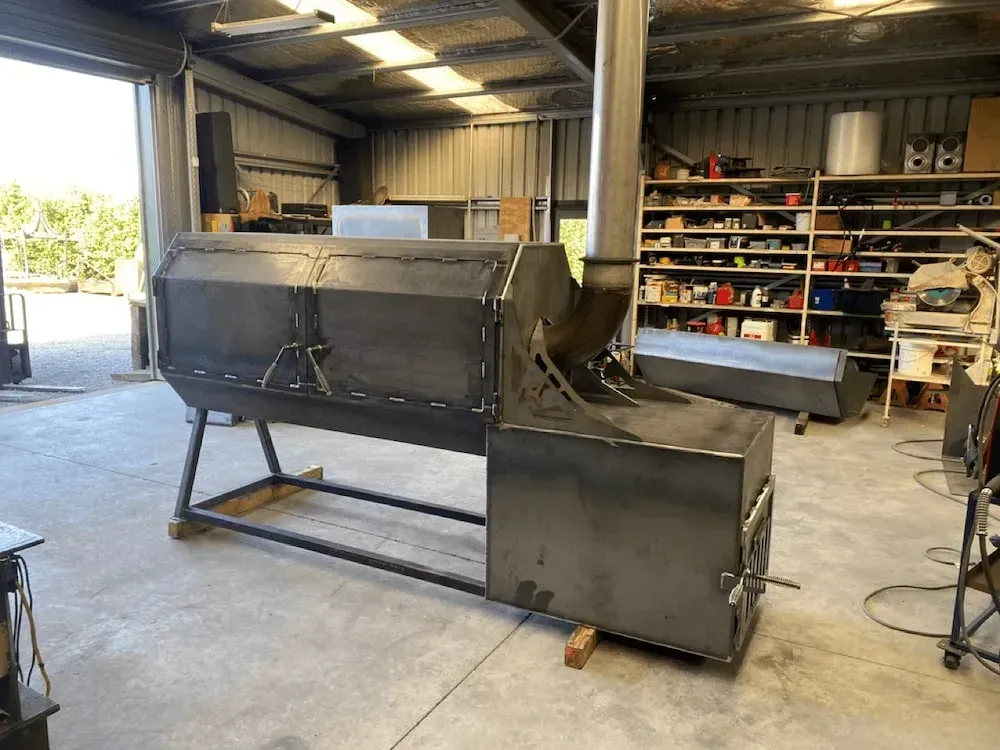 A large metal object is sitting in a warehouse.