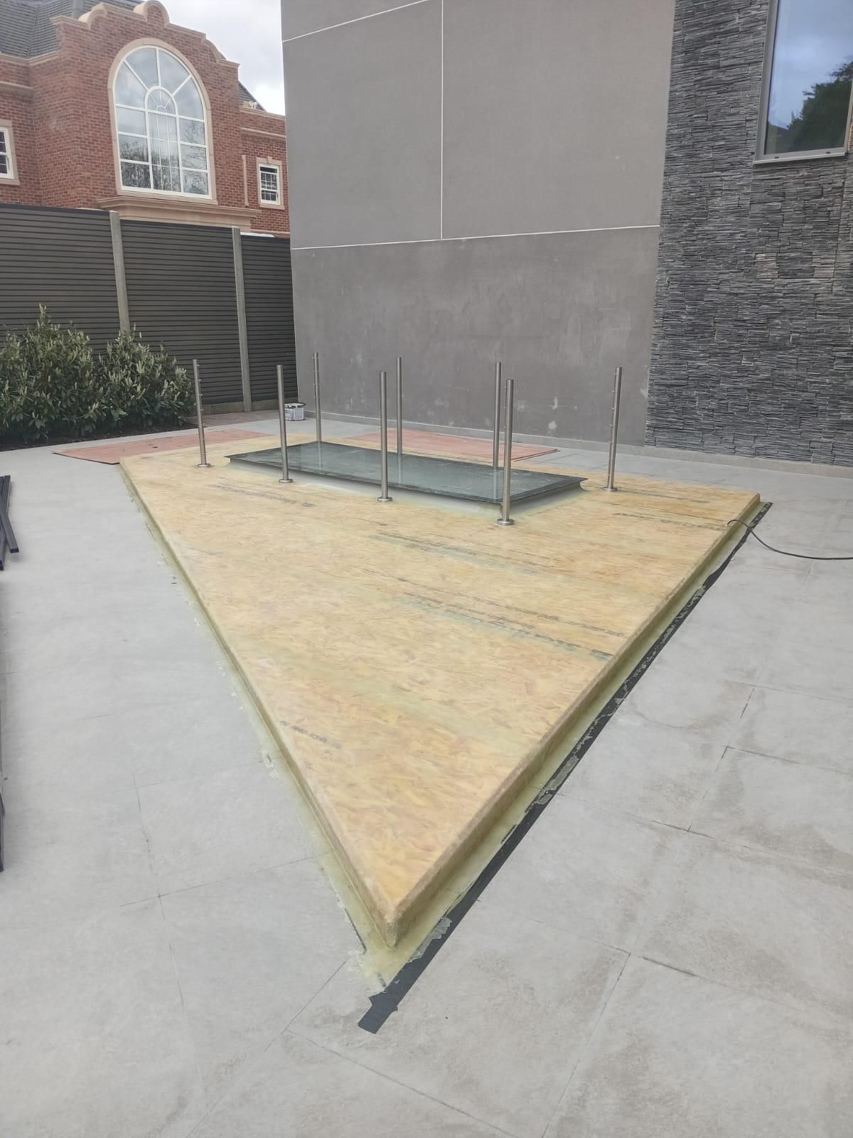 Glass and steel structure installation during external works