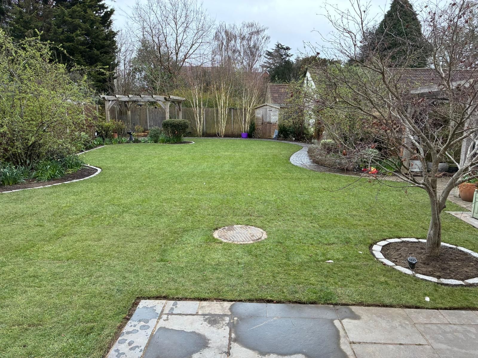 Completed garden landscaping with lawn restoration after rainwater harvesting works, Chislehurst
