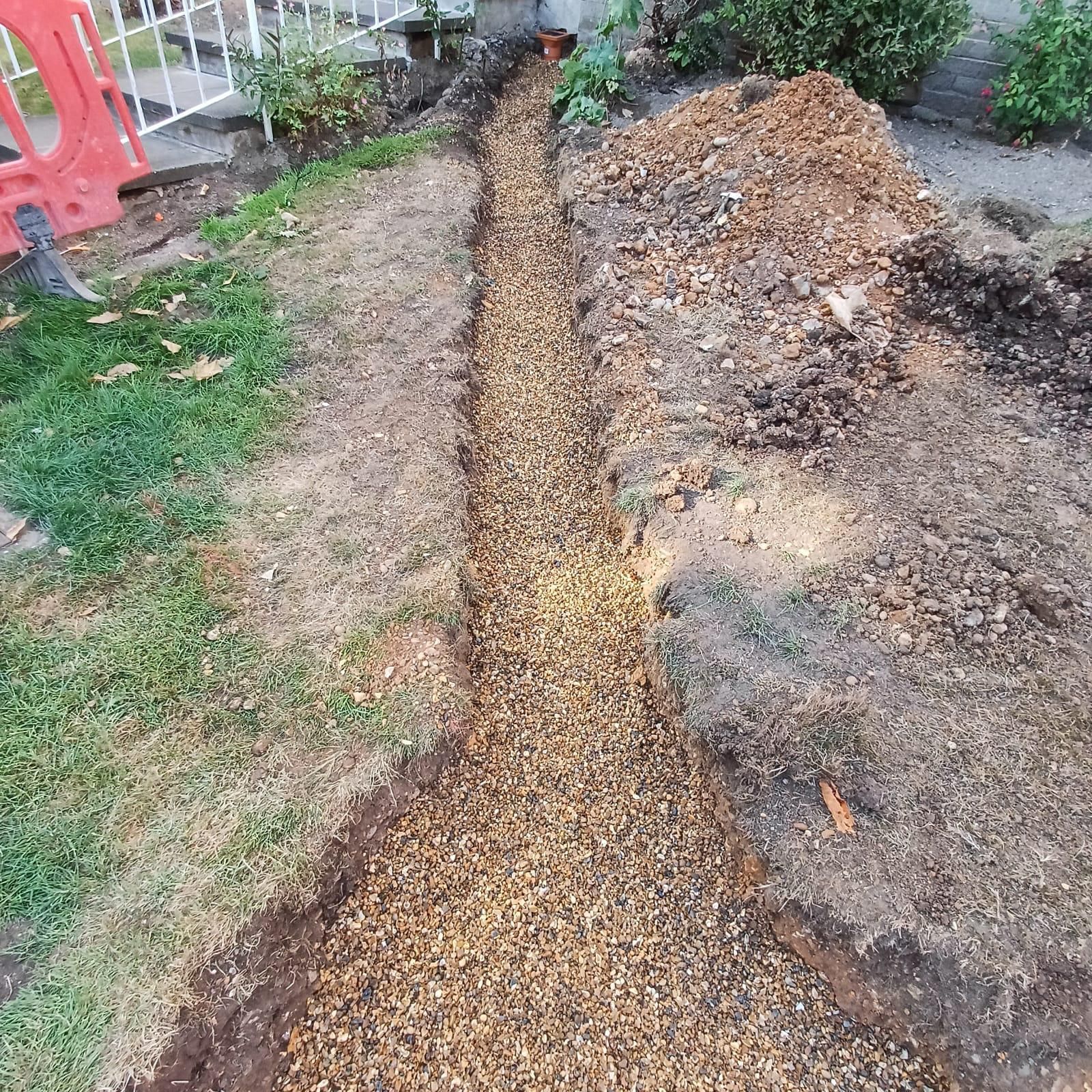 Soakaway drainage trench installation for car park, Bushy