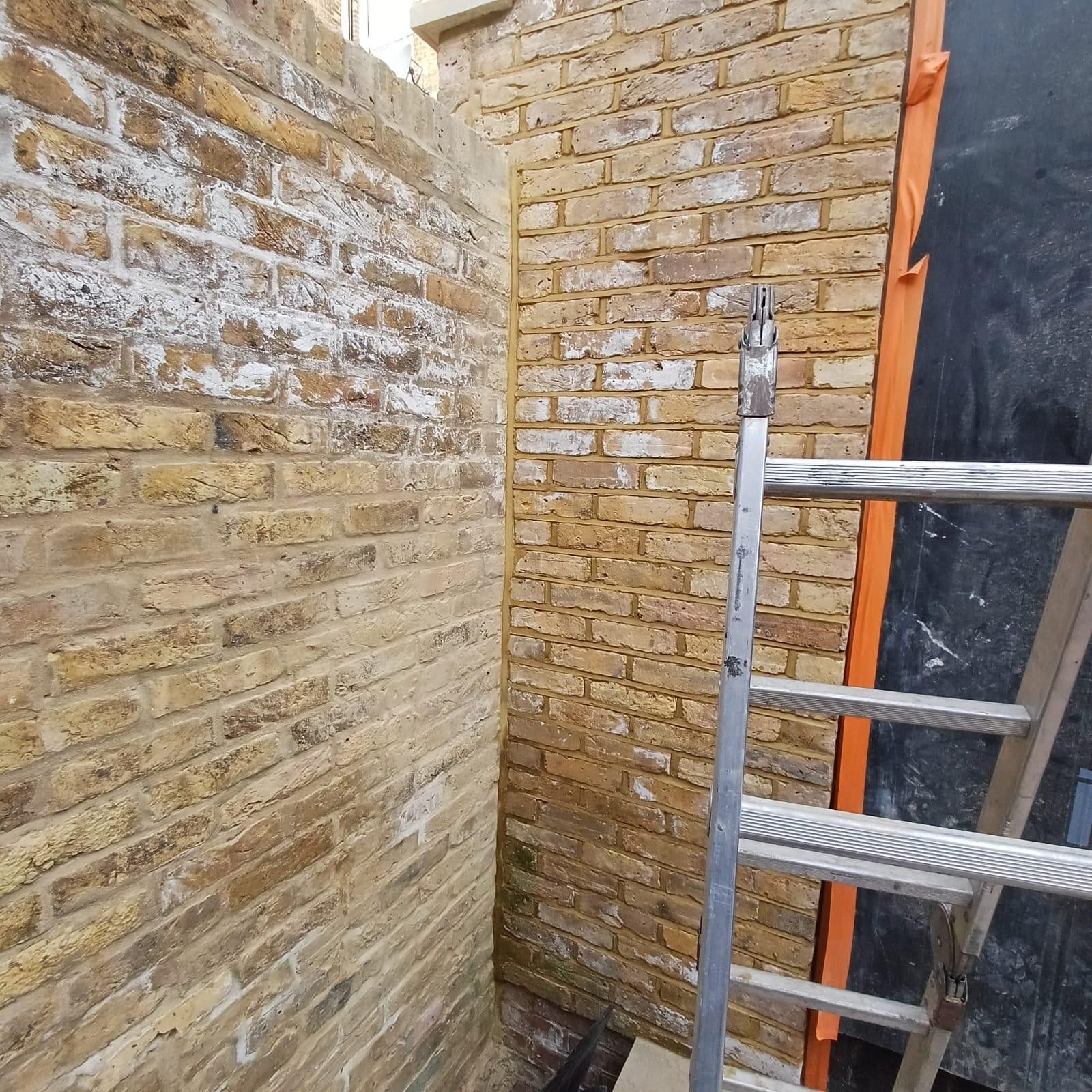 High-level scaffolding on brick building during repointing works, Leytonstone