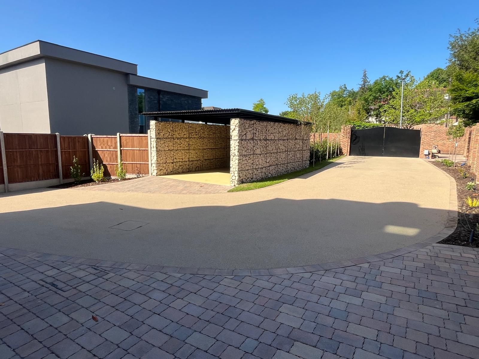 Completed carport and landscaped grounds at Sylvanias Cottages residential development, New Malden