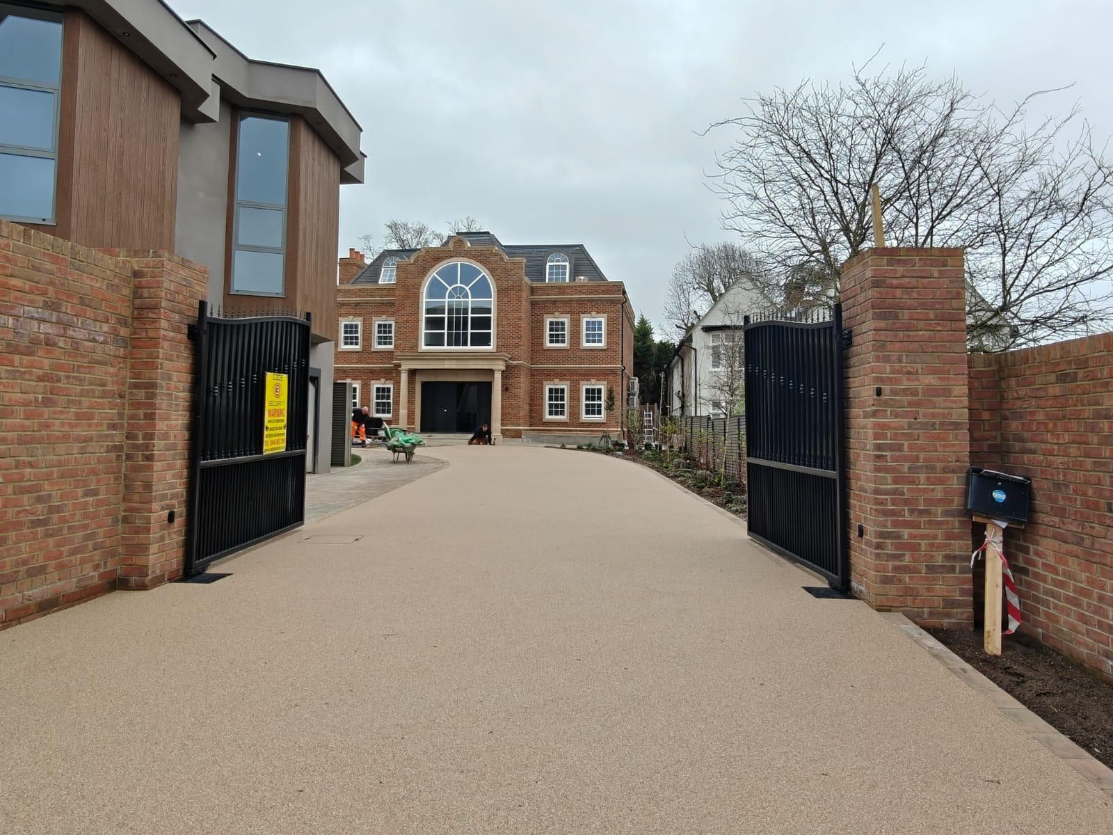 Completed carport and landscaped grounds at Sylvanias Cottages residential development, New Malden