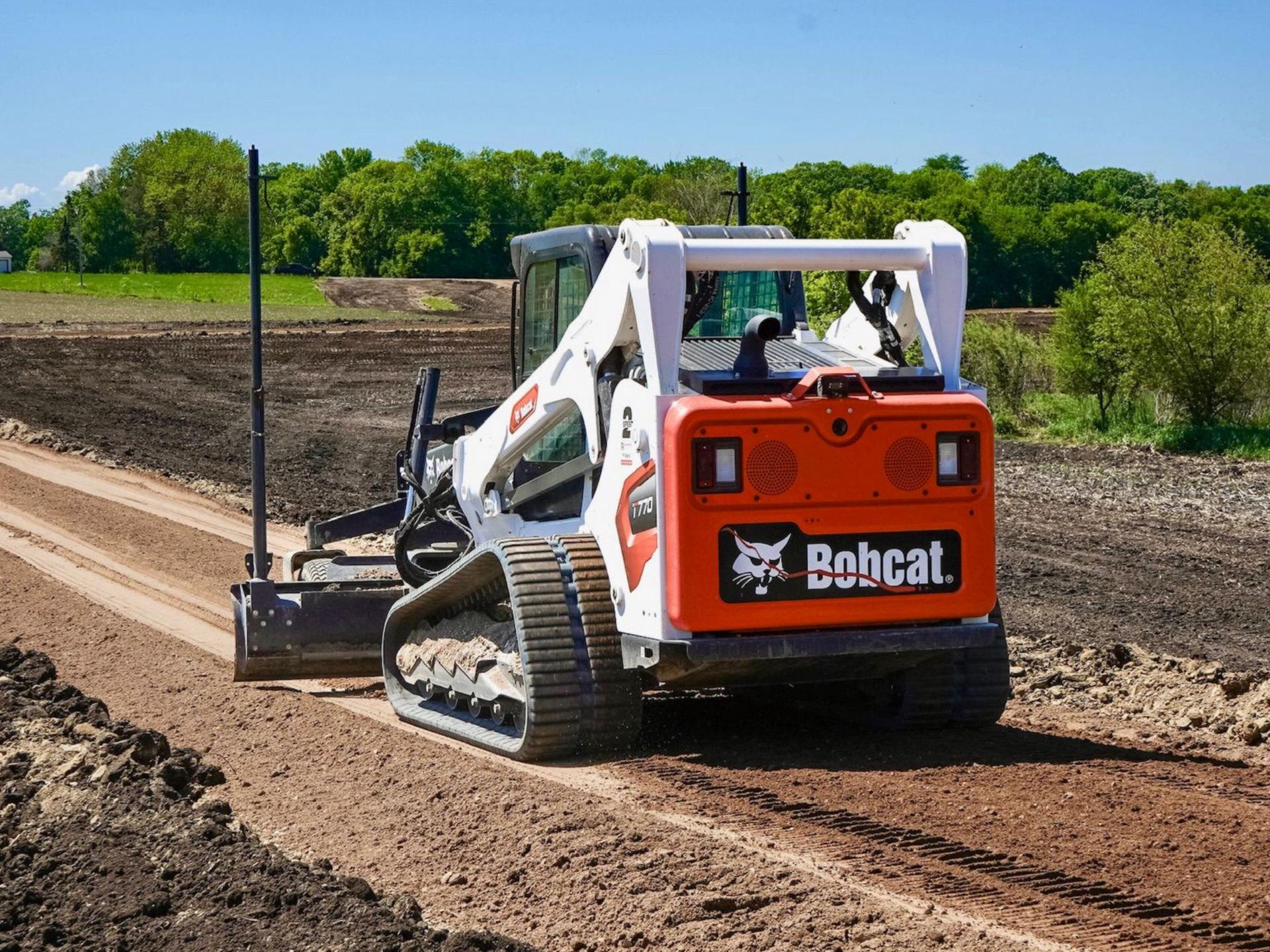 Bobcat T770 grading residential driveway in Cokato, MN