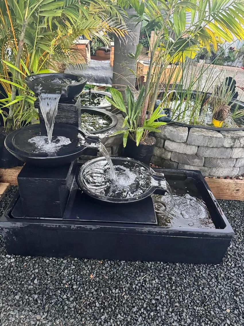 A Water Fountain on Top of a Gravel Tray in a Garden — Howard Landscape and Produce Supplies in Fraser Coast, QLD