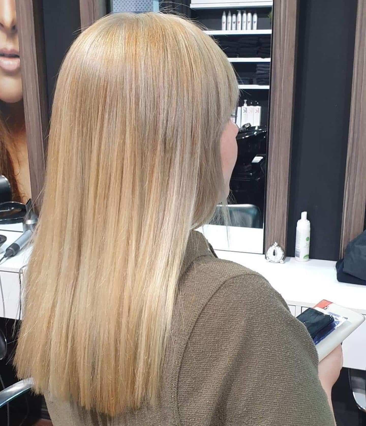 Woman With Smooth, Straight Blonde Hair at a Salon — Studio 23 In Biggera Waters, QLD