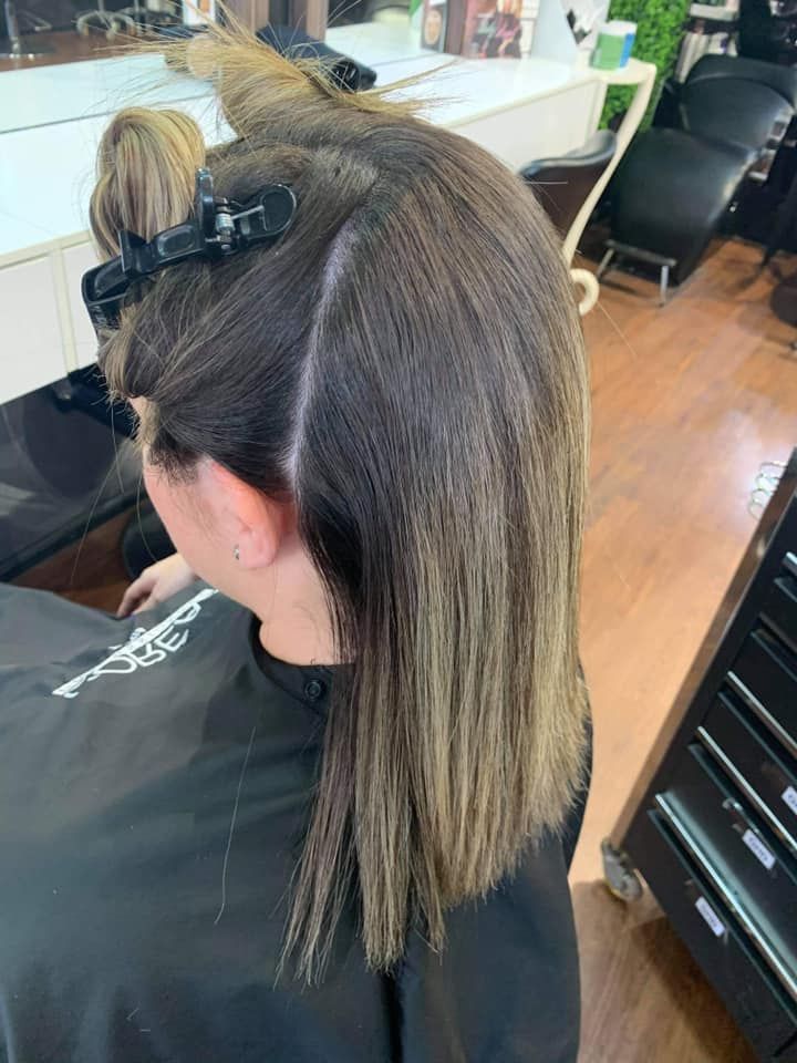 Woman With Dark Hair in a Salon, Sections Clipped for Styling — Studio 23 In Biggera Waters, QLD