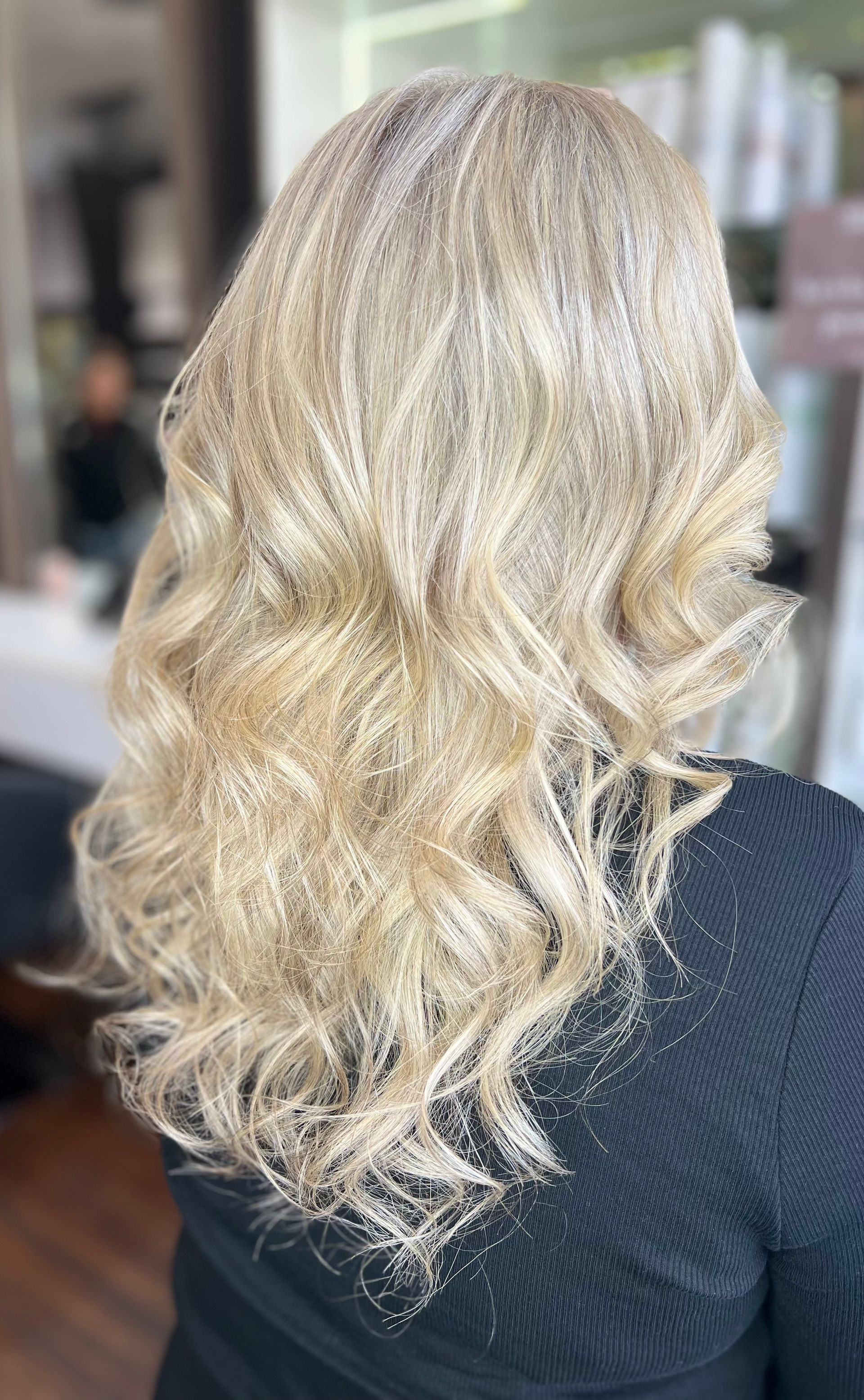 Blonde wavy hair with glitter, seen from the back. — Studio 23 In Biggera Waters, QLD
