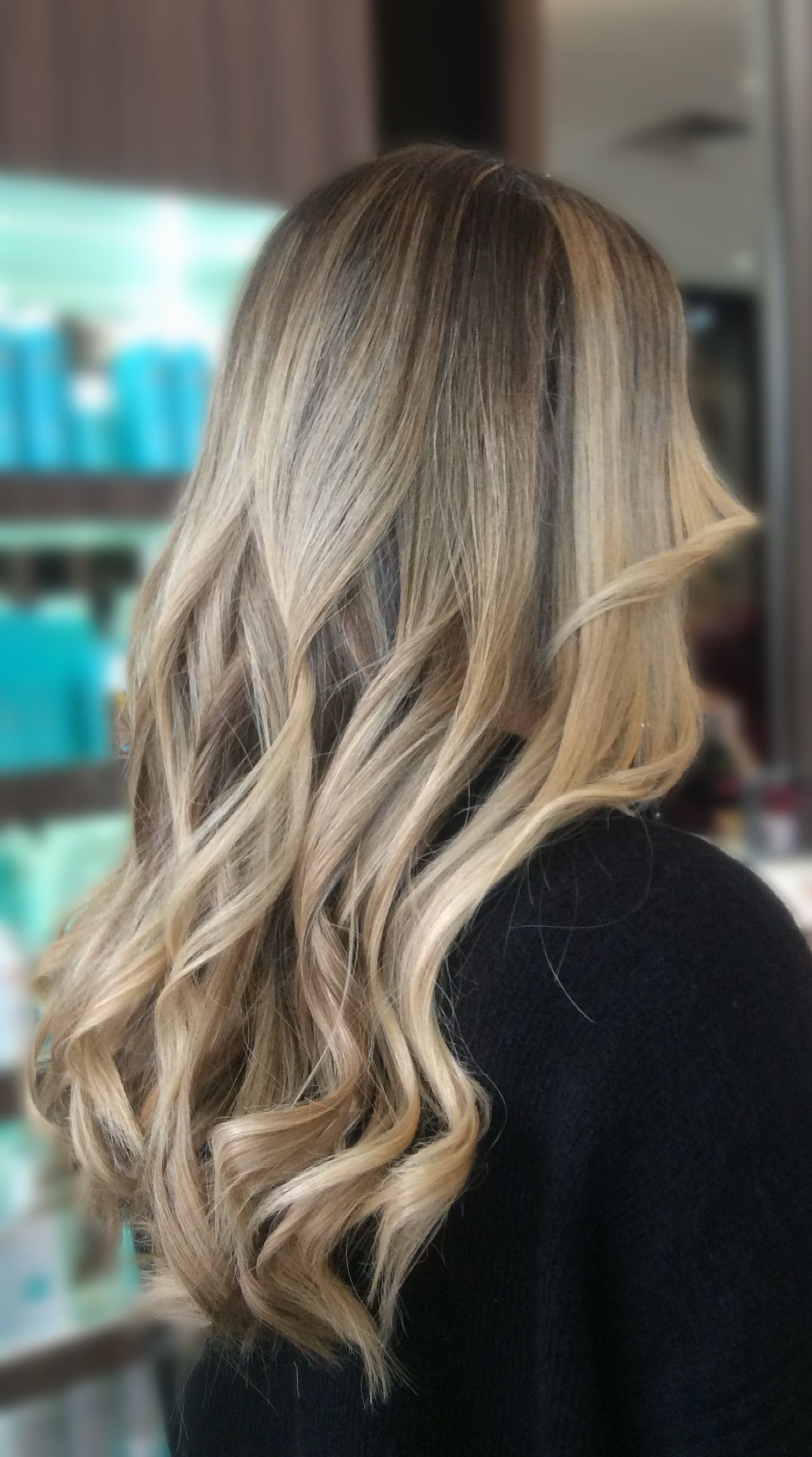 Woman With Wavy Brown Hair, Wearing Black Shirt, in a Salon — Studio 23 In Biggera Waters, QLD