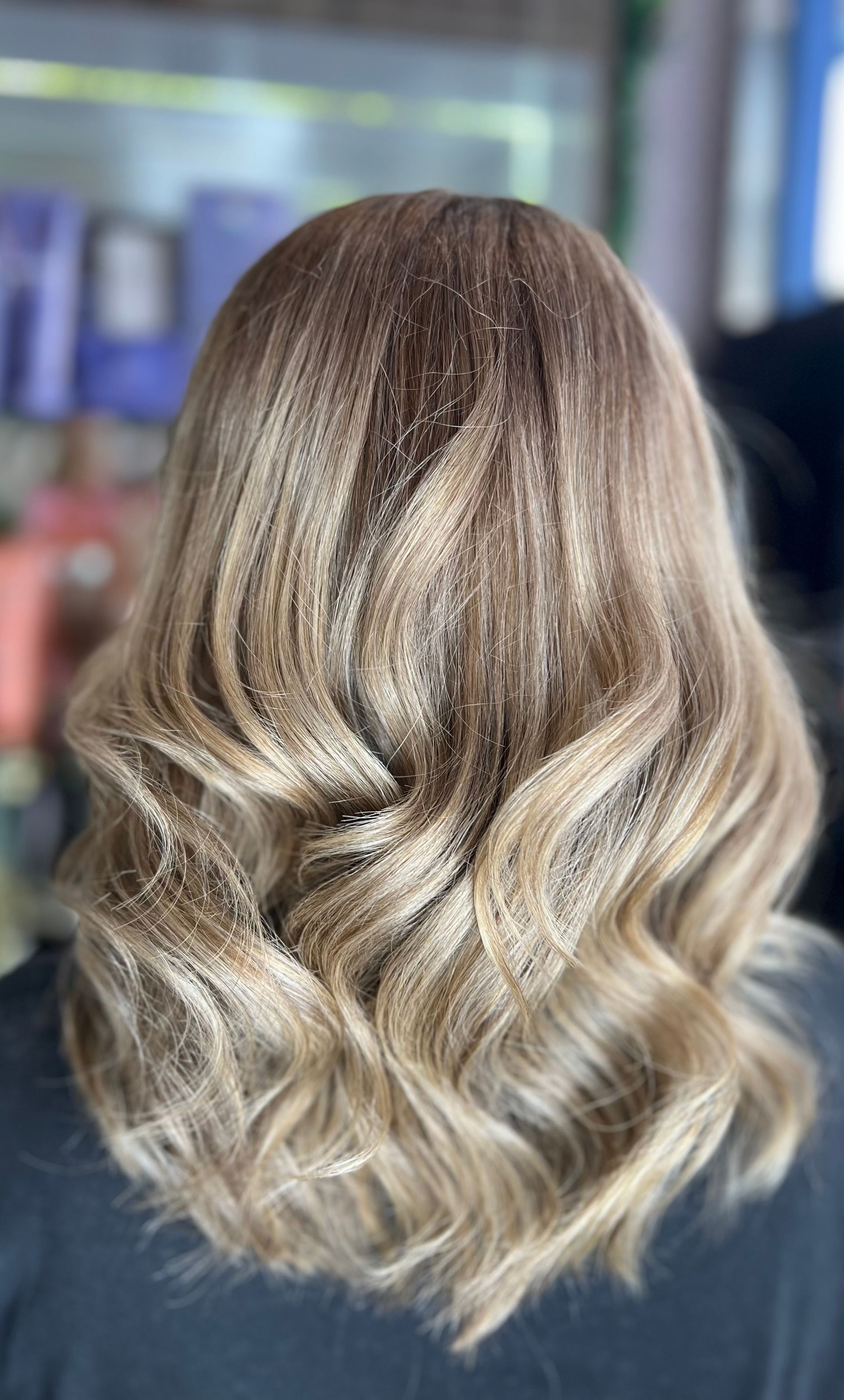 Woman With Wavy Blonde Hair in a Salon, Viewed From the Back — Studio 23 In Biggera Waters, QLD