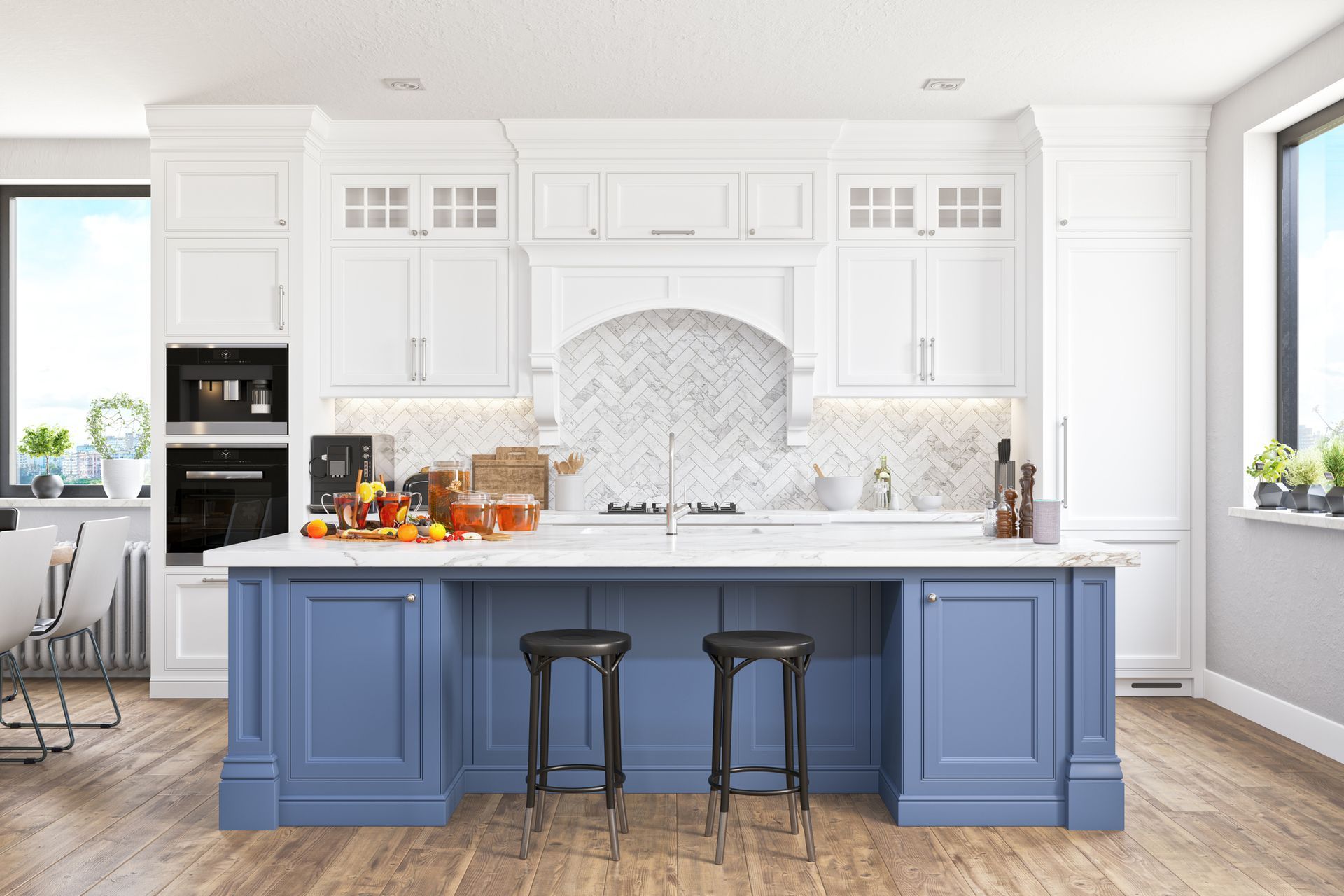 A kitchen with white cabinets and a blue island with two stools.