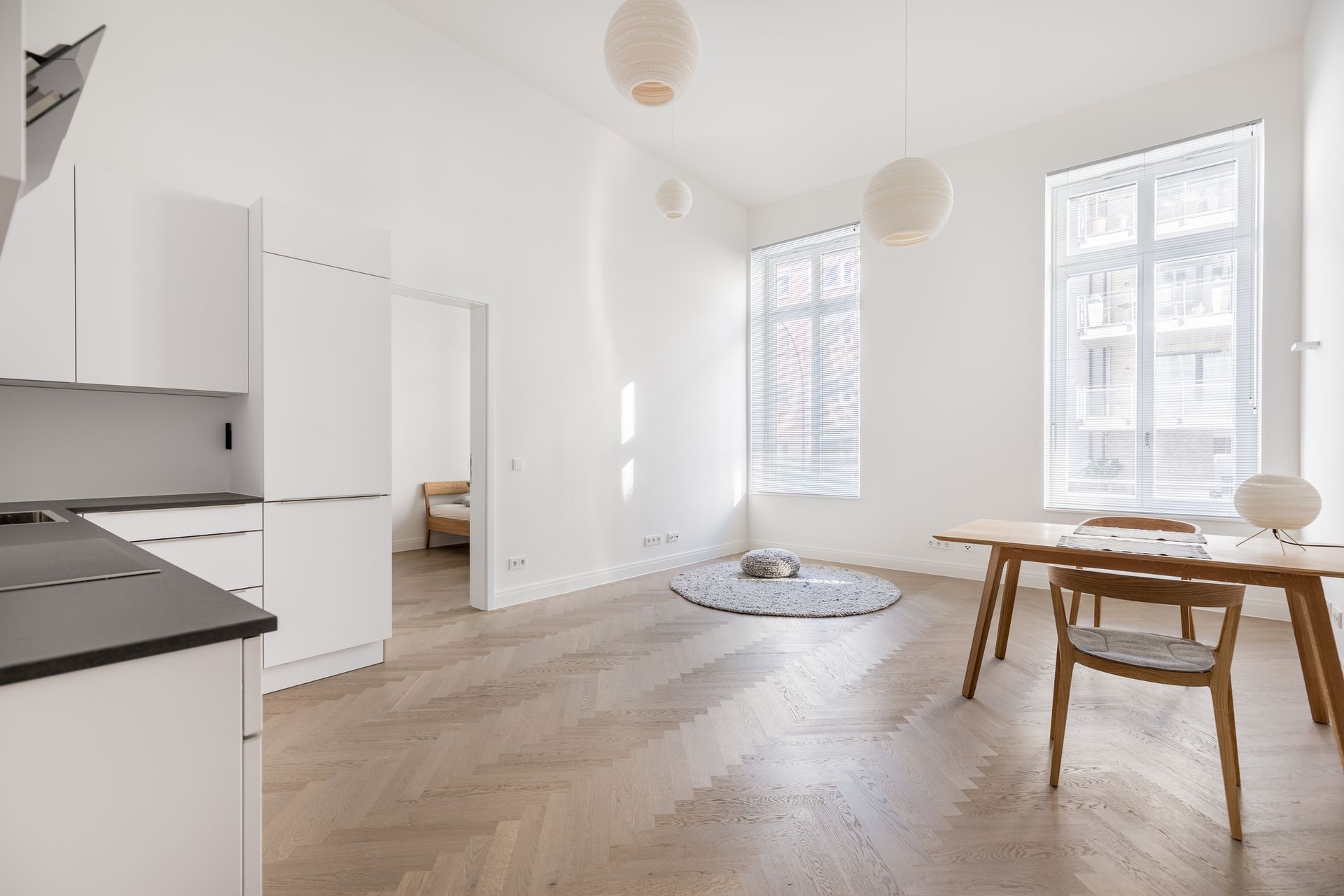 There is a table and chairs in the middle of the room. There is a table and chairs in the middle of the room.