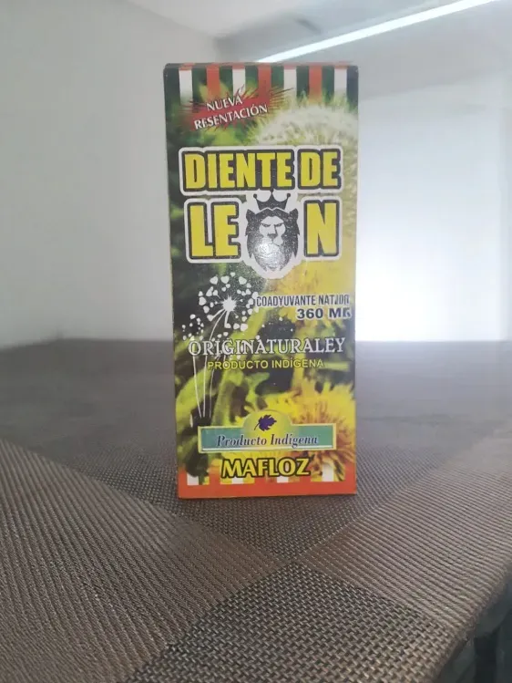 Caja de semillas de marihuana Diente de León sobre una superficie gris, con etiqueta frontal verde-amarilla