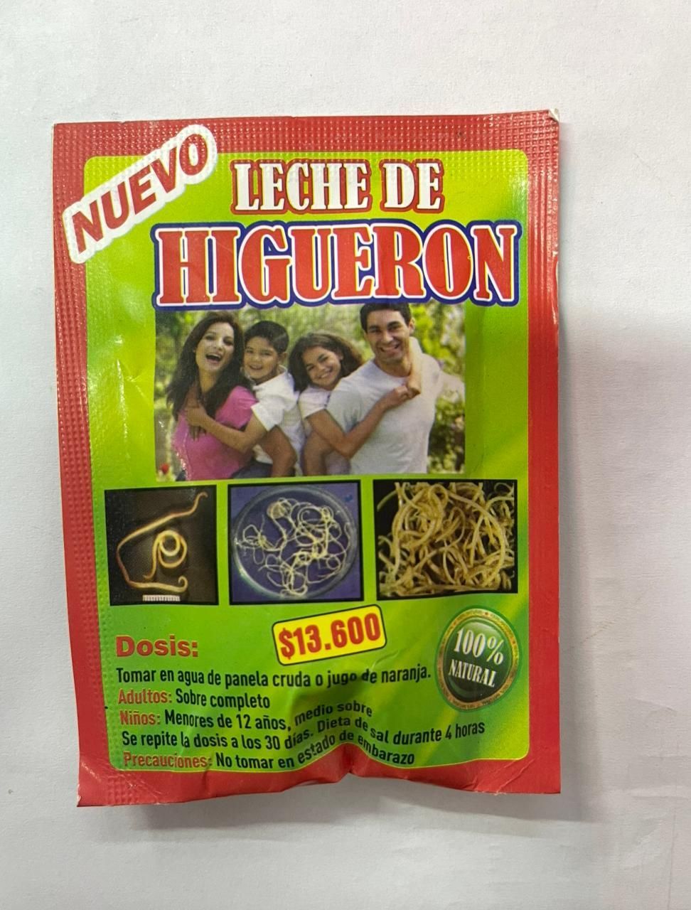 Envase rojo del producto herbal “Leche de Higuerón” con fotos y texto sobre la dosificación.
