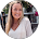 A woman in a white shirt is smiling in a circle.