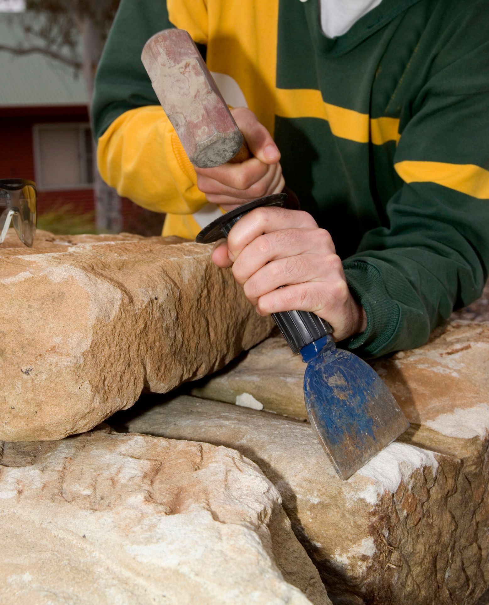Stone mason working on rock material – Colac, VIC - Bartlett Bros Pty Ltd