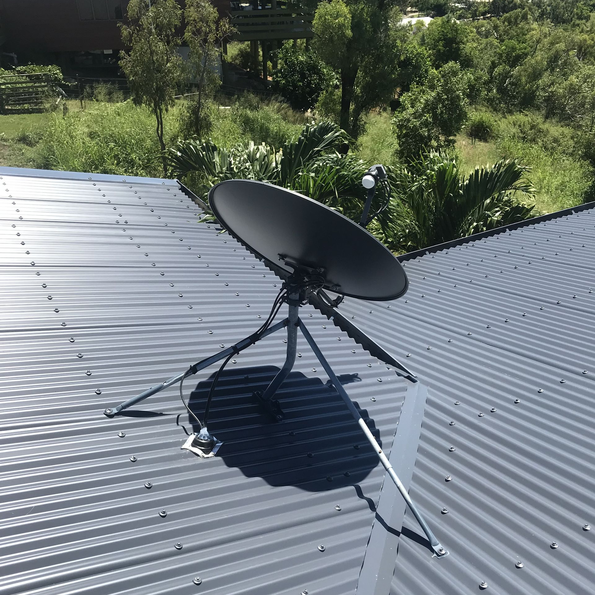 Person Adjusting a Vast Satellite — Apex Antenna Solutions Pty Ltd in Whitsundays, QLD
